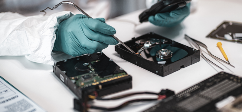 A man runs diagnostics in a lab on computer hardware