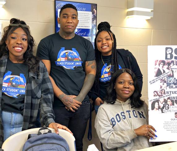 Four students recruit for the Black Student Union