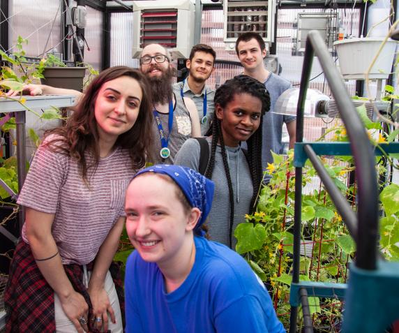 PTK students pose in the campus greenhouse