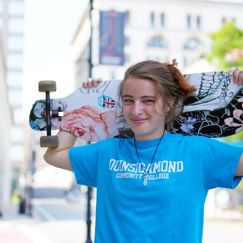 Hannah shows off her skateboard