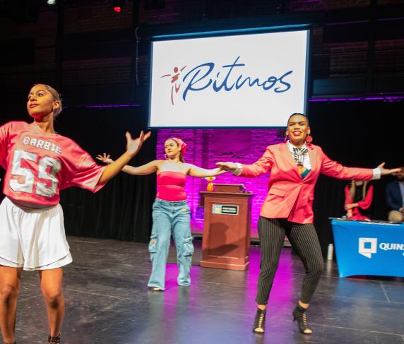 Keynote speaker Masielle Paulino (right) during a dance performance at the HACE Awards