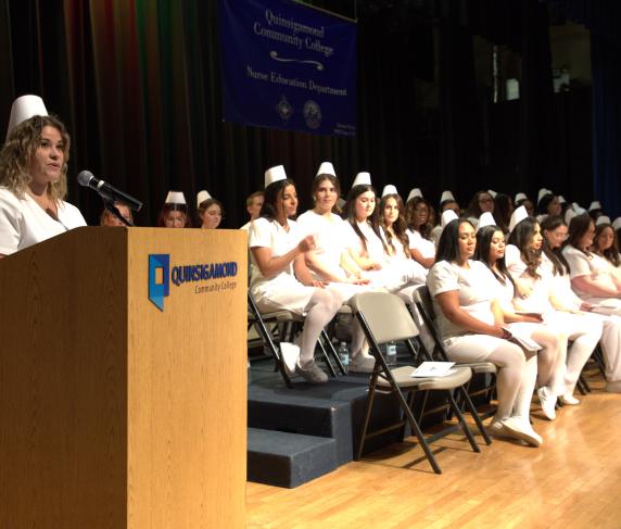 Class president of the Day Nurse Education Program Priscilla Araujo speaks during December's pinning ceremony