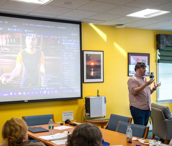 Learning Manager for Media Design Nate Mellow shows off some IMD equipment