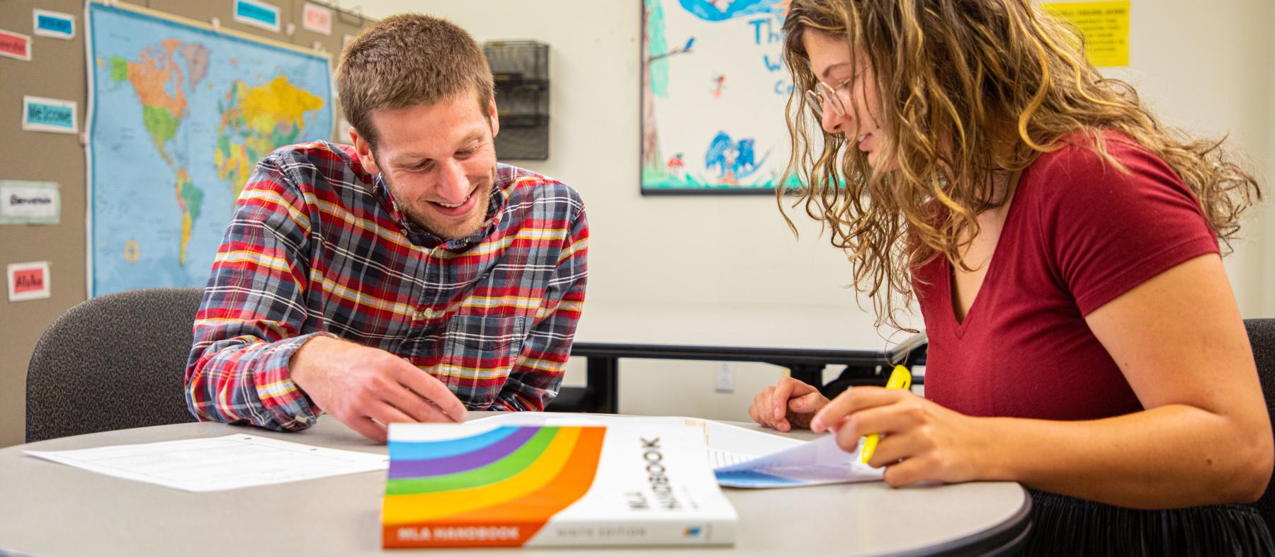 Student being tutored in the Writing Center