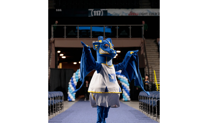 The Wyvern pumps up the crowd at the 2025 commencement ceremony. The Wyvern pumps up the crowd at the 2025 commencement ceremony.