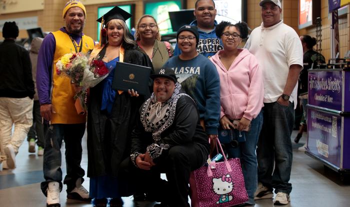 A proud family supports their grad at Commencement 2025. A proud family supports their grad at Commencement 2025.