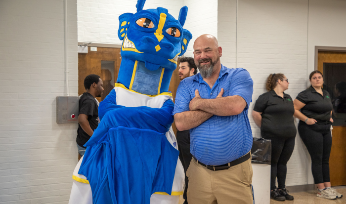 QCC student athlete Paul Landry hangs with the Wyvern at this year's athletic ceremony. QCC student athlete Paul Landry hangs with the Wyvern at this year's athletic ceremony.