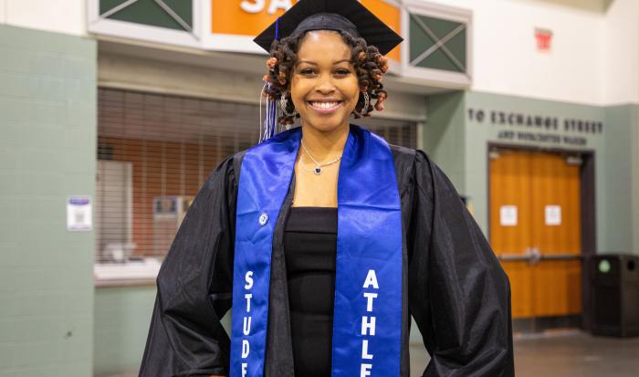 A student athlete graduate at QCC's 60th commencement ceremony. A student athlete graduate at QCC's 60th commencement ceremony.